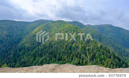 A view of the most beautiful mountains in a panoramic scene. View from Tomasovsky Vyhlad in Slovak Paradise National Park. A blue haze is in the air. 93776979
