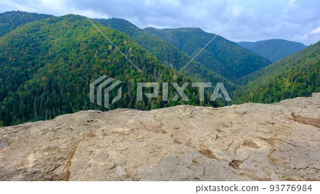 A view of the most beautiful mountains in a panoramic scene. View from Tomasovsky Vyhlad in Slovak Paradise National Park. A blue haze is in the air. 93776984