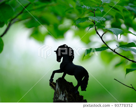 Green and horse figure Green and horse figure 93778352