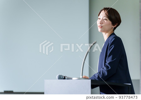 Business woman talking at a seminar Business woman talking at a seminar 93778473