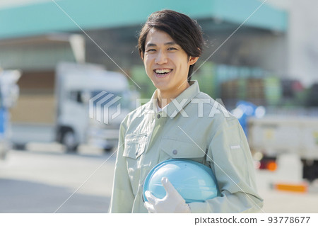 A young man working on clothes 93778677
