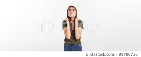 Isolated shot of speechless concerned shocked and angry woman, expressing silence and misconceptions, frightened. Isolated over grey background 93780710