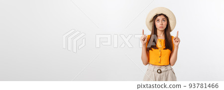 young pretty woman looking unhappy and stressed, suicide gesture making gun sign with hand, pointing to copy space. 93781466