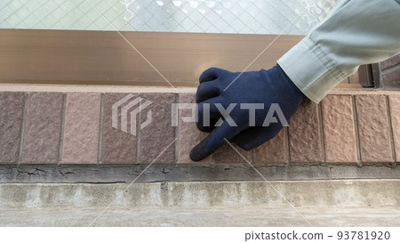 Workers inspecting the outer wall. Deterioration of joints. Workers inspecting the outer wall. Deterioration of joints. 93781920