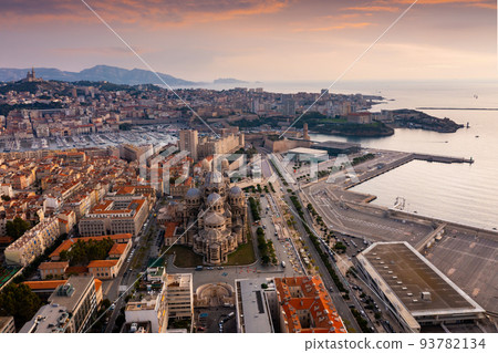 Drone view of Marseille with Cathedral, Fort Saint-Jean and Old Port at sunset 93782134