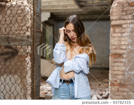 Portrait of young desirable woman in abandoned building 93782335