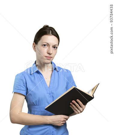 Elegant women in blue dress holds book in hands on white background. 93784438