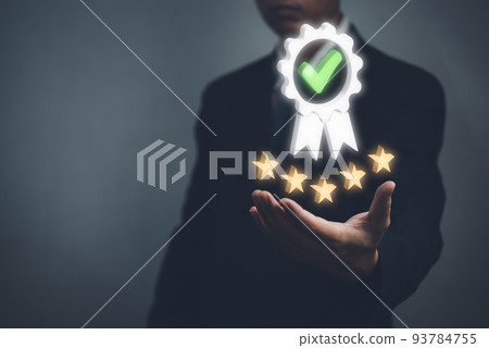 Hand shows the sign service Quality assurance 5 star, Guarantee, Standards, ISO certification and standardization concept. 93784755
