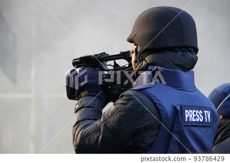 Journalist in protective helmet Journalist in protective helmet 93786429