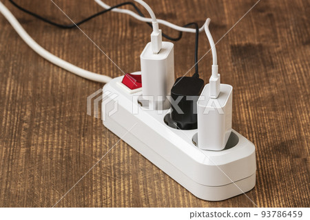 Electrical plugs with cords connected to electrical power strip Electrical plugs with cords connected to electrical power strip 93786459