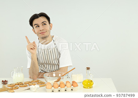 Concept of cooking with young attractive man Concept of cooking with young attractive man 93787499