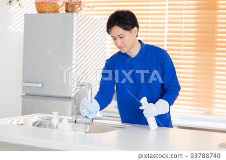 House cleaning A man cleaning the kitchen House cleaning A man cleaning the kitchen 93788740