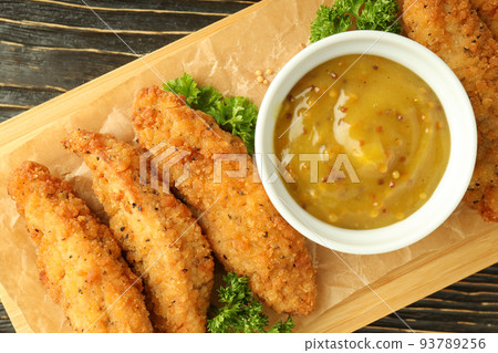 Concept of tasty food with chicken strips, top view Concept of tasty food with chicken strips, top view 93789256
