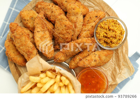 Concept of tasty food with chicken strips, top view Concept of tasty food with chicken strips, top view 93789266