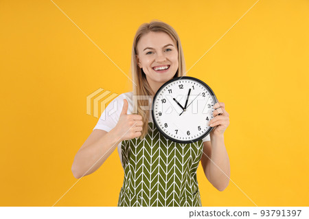 Concept of cooking with young woman on yellow background 93791397