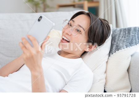 Middle-aged women lazing around at home 93791728