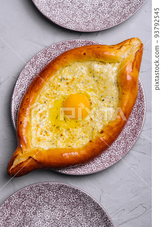 Georgian cuisine ajaruli khachapuri - georgian bread with egg and cottage cheese 93792545
