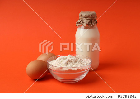 Concept of cooking cake or pie on orange background 93792842