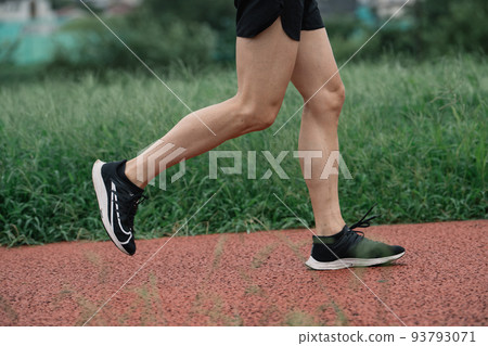 Feet of a man running Feet of a man running 93793071