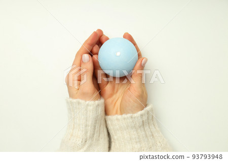 Female hands hold aroma candle on white background 93793948