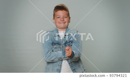 Greedy avaricious aggressive toddler boy child showing fig negative gesture, rapacious, avaricious 93794321