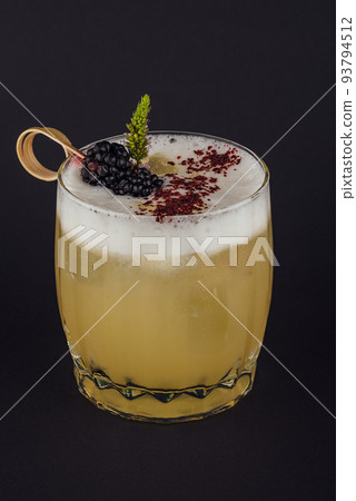 Fruit and herbal cold drink on black 93794512