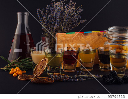 Multicolored transparent cocktails, a set of shots in one row 93794513