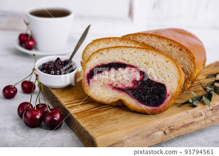 Homemade sweet cherry loaf cake on board Homemade sweet cherry loaf cake on board 93794561