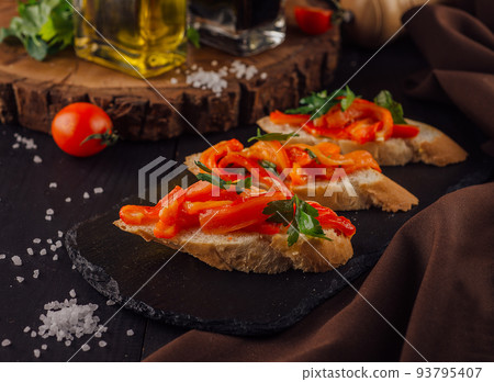 Bruschettas on cutting board close up Bruschettas on cutting board close up 93795407