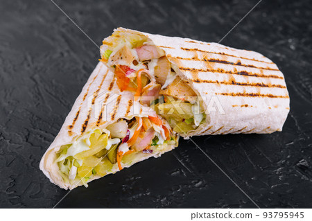 Delicious chicken shawarma on black stone 93795945