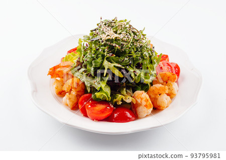 Healthy arugula salad bowl with shrimp, tomato, and sesame seeds Healthy arugula salad bowl with shrimp, tomato, and sesame seeds 93795981