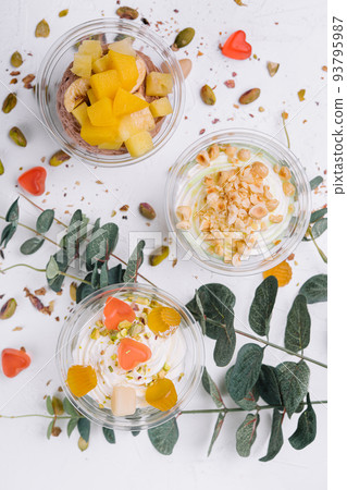 Soft chocolate and vanilla ice cream with pistachio, mango and jelly Soft chocolate and vanilla ice cream with pistachio, mango and jelly 93795987