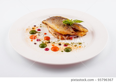 Fried fish fillet. cod with sauce and herbs Fried fish fillet. cod with sauce and herbs 93796367