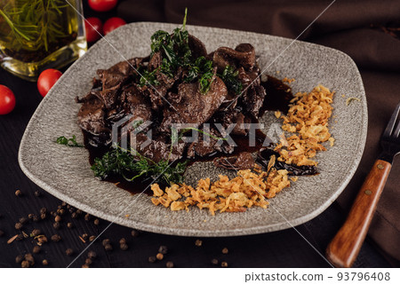 Beef liver with onions chips on plate Beef liver with onions chips on plate 93796408
