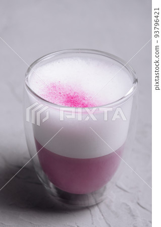 Pink matcha latte with milk close up Pink matcha latte with milk close up 93796421