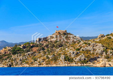 View of ancient Lycian town Simena with fortress on a mount on the coast of the Mediterranean sea in Antalya Province, Turkey View of ancient Lycian town Simena with fortress on a mount on the coast of the Mediterranean sea in Antalya Province, Turkey 93796490