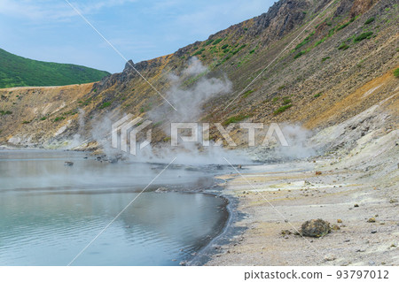 hot mineralized lake with thermal spring and smoking fumaroles in the caldera of the Golovnin volcano on the island of Kunashir hot mineralized lake with thermal spring and smoking fumaroles in the caldera of the Golovnin volcano on the island of Kunashir 93797012