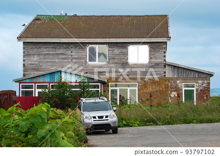 wooden house in a fishing town on the shore of the sea bay, seagulls nest on the roof wooden house in a fishing town on the shore of the sea bay, seagulls nest on the roof 93797102