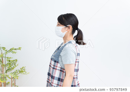 Profile of a nursery teacher wearing a mask 93797849