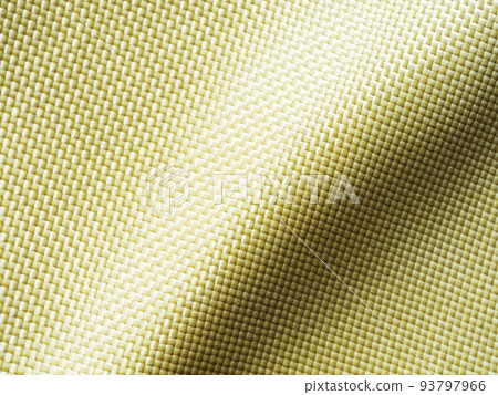 Selective focus. Bulletproof material aramid. Aramid kevlar background. Golden kevlar texture and pattern. Selective focus. Bulletproof material aramid. Aramid kevlar background. Golden kevlar texture and pattern. 93797966