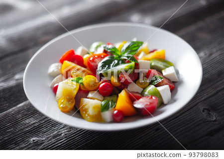 Salad with different varieties kind of tomatoes Salad with different varieties kind of tomatoes 93798083