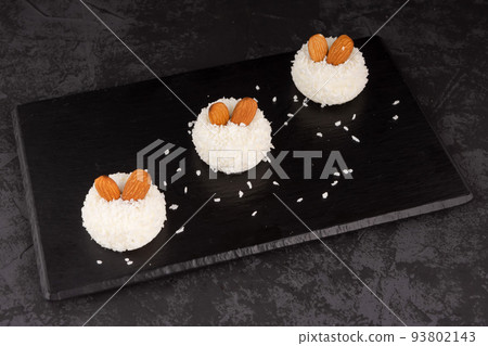 delicious dessert creamy souffle decorated with coconut chips and nuts delicious dessert creamy souffle decorated with coconut chips and nuts 93802143