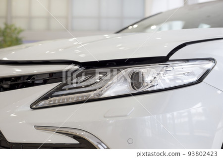 New modern unknown car with elegant head lamps. 93802423