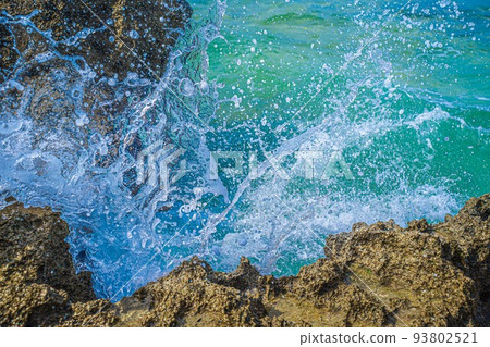 Wave splash against the rock Wave splash against the rock 93802521