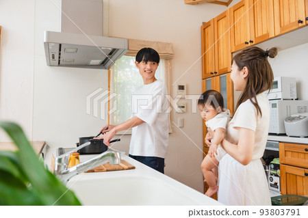 family together in the kitchen 93803791