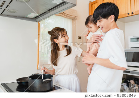 family together in the kitchen 93803849