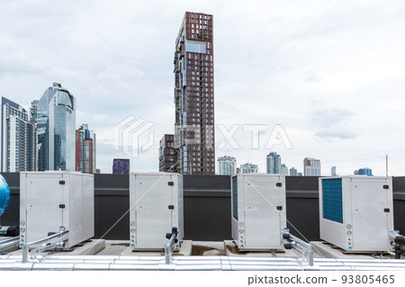 Air conditioner compressor installed on roof building.  93805465