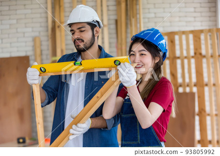 Carpenter working in carpentry shop. Carpenter working to making wood furniture in wood workshop 93805992