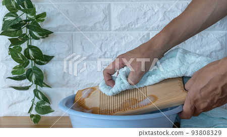 Washing on a wooden washboard Washing on a wooden washboard 93808329