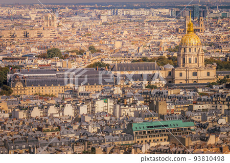 Les Invalides and parisian roofs at golden sunrise Paris, France 93810498